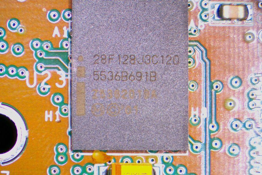 Intel 28F128J3 NOR flash at U23.