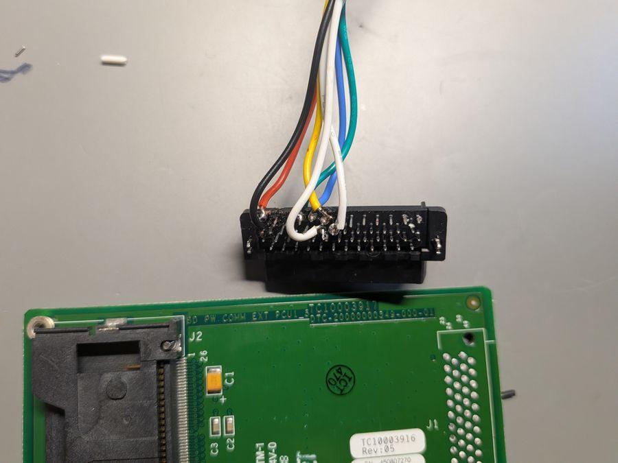 Salvaged connector with JTAG cables soldered on.
